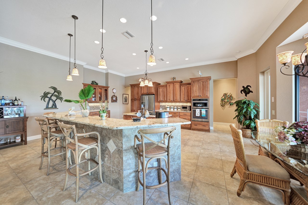 open kitchen with center island and breakfast bar.