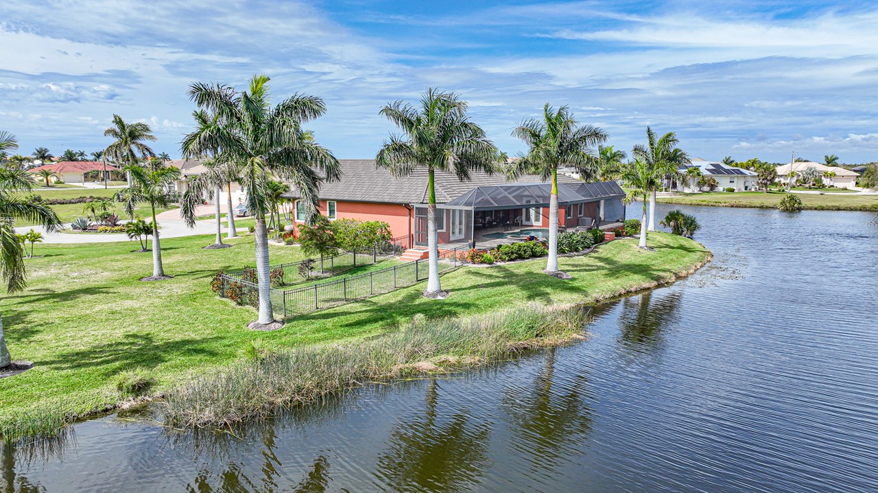 rear of home with lake views from 3 sides.