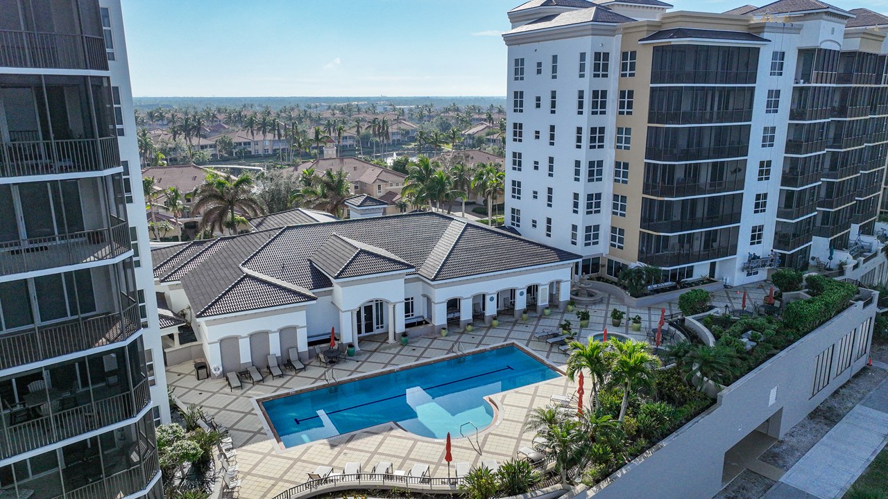 lap pool with spa, and outdoor grills.
